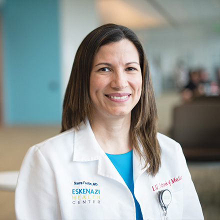 Female provider smiling at the camera