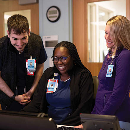 Sandra Eskenazi Mental Health Center nurses working around a computer