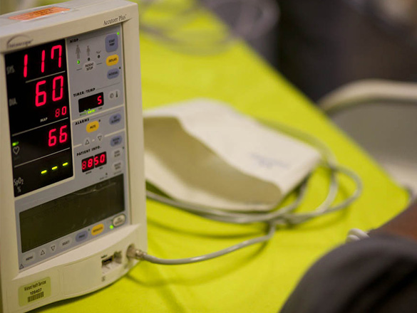 Testing equipment shows a display of numbers and indicators