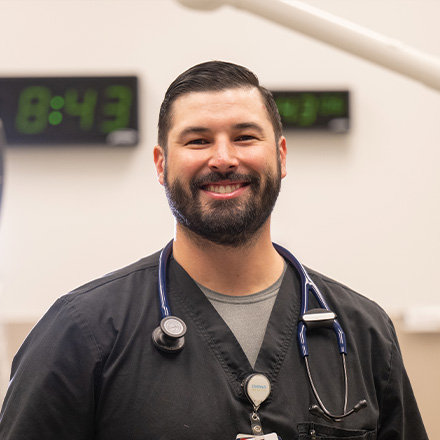 Male nurse smiling at the camera