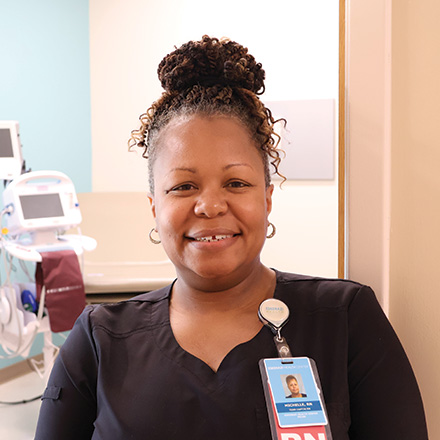 Female nurse smiling at the camera